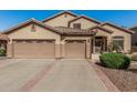 Charming single-story home features a tile roof and a spacious three-car garage at 26249 N 68Th Ln, Peoria, AZ 85383