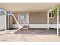 Spacious carport featuring concrete flooring, metal canopy, and convenient side door access at 2650 W Union Hills Dr # 100, Phoenix, AZ 85027