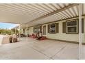 Wide, covered patio with outdoor furniture, ideal for relaxation and entertainment at 33852 N 52Nd St, Cave Creek, AZ 85331