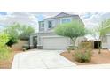 Charming two-story home featuring desert landscaping and a two-car garage at 3402 N 300Th Dr, Buckeye, AZ 85396