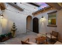 Private courtyard featuring a fountain, string lights, and comfortable seating at 3872 E Jude Ln, Gilbert, AZ 85298