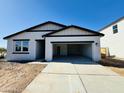 Modern, single-story home featuring a light stucco exterior, dark trim, a two-car garage, and concrete driveway at 46819 W Cansados Rd, Maricopa, AZ 85139