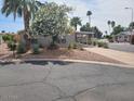 Charming single-story home with well-maintained landscaping and a covered parking area at 5402 E Mckellips Rd # 103, Mesa, AZ 85215