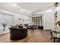 Bright living room featuring wood flooring, high ceilings, and neutral colors at 654 W Fremont Dr, Tempe, AZ 85282