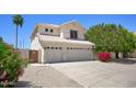Charming two-story home with a three car garage, desert landscaping, and large driveway at 8228 S Stephanie Ln, Tempe, AZ 85284