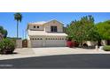 Charming two-story home with a three car garage, desert landscaping, and large driveway at 8228 S Stephanie Ln, Tempe, AZ 85284