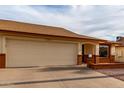 Single-story home featuring a two-car garage, desert landscaping, and appealing front with brick accents at 8255 E Kiva Ave # 420, Mesa, AZ 85209
