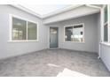 Private outdoor patio with gray brick flooring and stucco wall finish at 852 W Golden Ore Pass, Apache Junction, AZ 85120