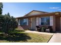 Cozy brick home with a tidy yard and a covered patio set for relaxing outside at 9602 W Ironwood Dr # A, Peoria, AZ 85345