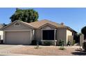Charming single-story home with a two-car garage and well-maintained desert landscaping at , Mesa, AZ 85205