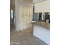 Pantry and breakfast bar featuring granite countertops and white cabinetry in kitchen at , Mesa, AZ 85205