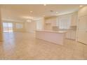 Bright open floorplan features a modern kitchen with a large island and stainless steel appliances at 1130 E Westwood Dr, Casa Grande, AZ 85122