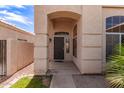 Close up of the front entrance to this home with covered porch and manicured lawn at 11411 W Dana Ln, Avondale, AZ 85392