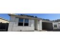 A new construction home with a garage, reflecting modern architectural styles at 15792 W Beryl Ave, Waddell, AZ 85355