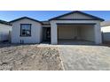Charming single-Gathering home featuring an attached two-car garage and a well-lit window at 15792 W Beryl Ave, Waddell, AZ 85355