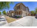 A two-story home showing the side of the property with a wide driveway at 2337 E Fraktur Rd, Phoenix, AZ 85040