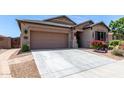 Charming single-story home with desert landscaping, and a two-car garage at 23707 W Hess Ave, Buckeye, AZ 85326