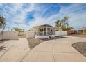 Home featuring a covered porch and wide driveway, enhancing the home's accessibility at 2388 S Vista Rd, Apache Junction, AZ 85119