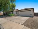 Attractive home with a two-car garage, nice landscaping, and a concrete driveway at 271 W Roadrunner Dr, Chandler, AZ 85286
