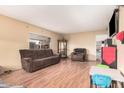 Comfortable living room area with laminate flooring, perfect for relaxation and entertainment at 3238 W Altadena Ave, Phoenix, AZ 85029