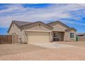Single-story home with a two-car garage, desert landscaping, and long driveway at 34834 N Surrey Ln, San Tan Valley, AZ 85140