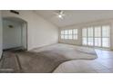 Spacious living room featuring large windows and access to the outdoors at 3833 W Rene Dr, Chandler, AZ 85226