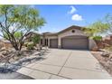 Spacious 3-car garage and well-manicured front yard offering great curb appeal to this gorgeous home at 41908 N Harbour Town Ct, Anthem, AZ 85086