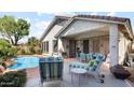 Relaxing backyard patio with a private pool and comfortable lounge chairs, perfect for entertaining at 4223 E Wildcat Dr, Cave Creek, AZ 85331
