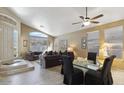 Bright living room with high ceilings, large windows, and elegant tile flooring at 4223 E Wildcat Dr, Cave Creek, AZ 85331