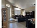 Bright living room with high ceilings, tile flooring, and stylish decor and comfortable seating at 4223 E Wildcat Dr, Cave Creek, AZ 85331