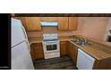 Functional kitchen with essential appliances and ample counter space at 4601 N 102Nd Ave # 2202, Phoenix, AZ 85037