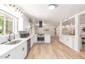 Open-concept kitchen featuring stainless appliances, modern cabinetry, and tile floors at 506 W Seldon Ln, Phoenix, AZ 85021
