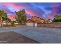 Exterior view of home, showcasing the three-car garage and spacious driveway at 6550 N 7Th St, Phoenix, AZ 85014