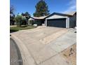 Charming single-story home featuring a well-maintained front yard and attached two-car garage at 696 W Shawnee Dr, Chandler, AZ 85225