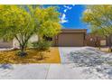 Charming single-story home with beautiful desert landscaping and a spacious two-car garage at 12565 W Palmaire Ave, Glendale, AZ 85307