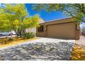 Charming single-story home with beautiful desert landscaping and a spacious two-car garage at 12565 W Palmaire Ave, Glendale, AZ 85307