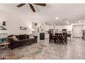 Open-concept living area seamlessly connects the living room, dining space, and a modern kitchen at 12565 W Palmaire Ave, Glendale, AZ 85307
