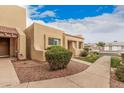 Delightful exterior highlighting the well-kept grounds and architectural details of this inviting home at 14402 N 58Th Dr, Glendale, AZ 85306