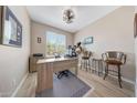 Well-lit office space with tile floors, large window and comfortable furniture at 14408 W Bloomfield Rd, Surprise, AZ 85379