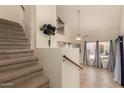 Inviting home entryway featuring staircase, tiled flooring, and bright natural light from the large windows at 1535 N Horne -- # 67, Mesa, AZ 85203