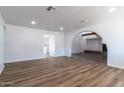 Open-concept living room with modern flooring and lots of natural light at 1550 W Willow Ave, Phoenix, AZ 85029