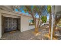 Inviting front porch with decorative double doors, a brick paver walkway, and lush landscaping at 1615 E Fremont Dr, Tempe, AZ 85282