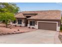 Lovely single-story home boasting a meticulously maintained yard and a convenient two-car garage at 18 E Paint Your Wagon Trl, Phoenix, AZ 85085