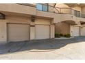 Three attached garages with desert landscaping and low maintenance ground covering at 2019 E Campbell Ave # 110, Phoenix, AZ 85016