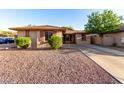 Charming single-story home featuring desert landscaping, a tile roof, and a private driveway at 2315 W Beverly Rd, Phoenix, AZ 85041