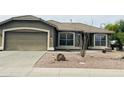 Inviting single-story home featuring low-maintenance desert landscaping and an attached two-car garage at 3176 E Palm Beach Dr, Chandler, AZ 85249