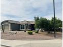 Beautiful single-story home featuring low-maintenance desert landscaping, a two-car garage, and a well-maintained yard at 3176 E Palm Beach Dr, Chandler, AZ 85249