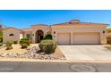 Charming single-story home with a terracotta-tiled roof, neutral stucco, and a two-car garage at 4633 E Chaparosa Way, Cave Creek, AZ 85331