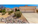 Inviting single-story home with desert landscaping and a two-car garage at 4633 E Chaparosa Way, Cave Creek, AZ 85331