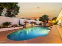 Sparkling backyard pool and waterfall feature at 4833 N 38Th St, Phoenix, AZ 85018